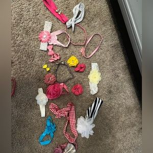 Bundle of baby headbands, clips,etc.